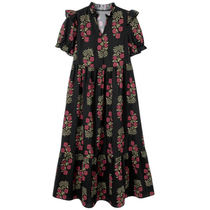 Front view of a black and pink floral cotton midi dress with puff sleeves and a tiered ruffle hem.