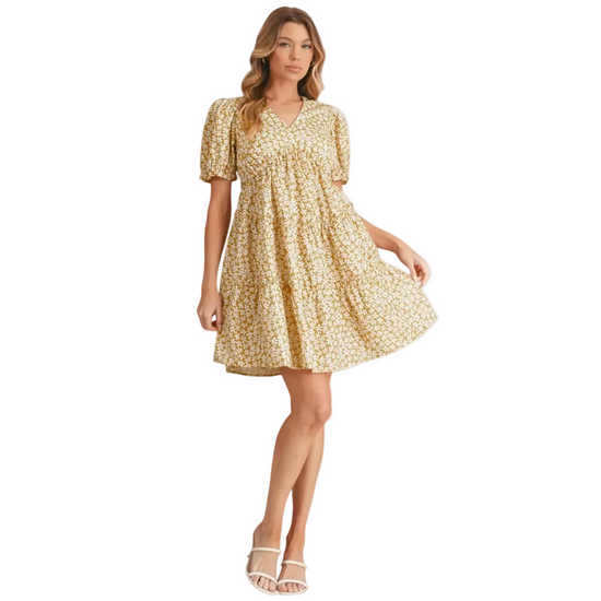 Yellow tiered midi dress with a smocked bodice, V-neckline, and feminine flutter sleeves.
