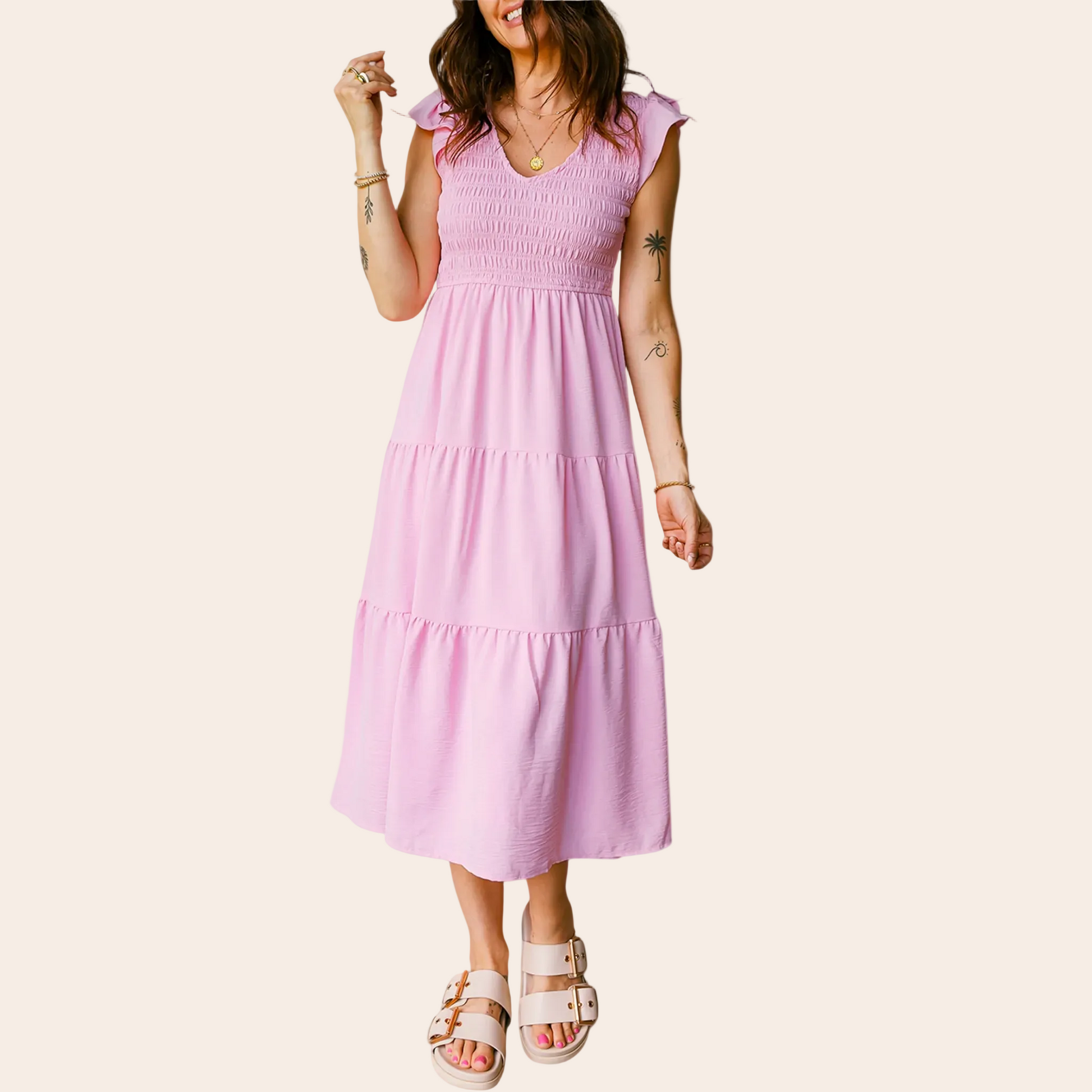 Woman wearing a pink dress on a beige background