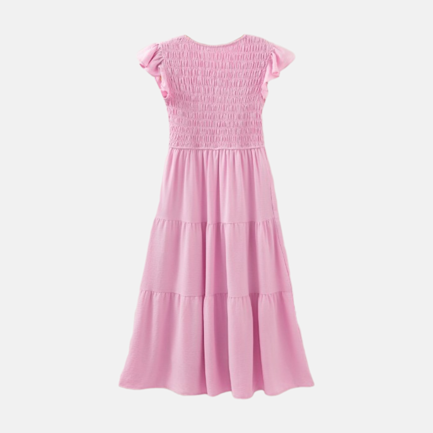 A studio product shot showing the back of a light pink midi dress. The image highlights the uniform smocking texture across the bodice and the simple, elegant tiers of the skirt.