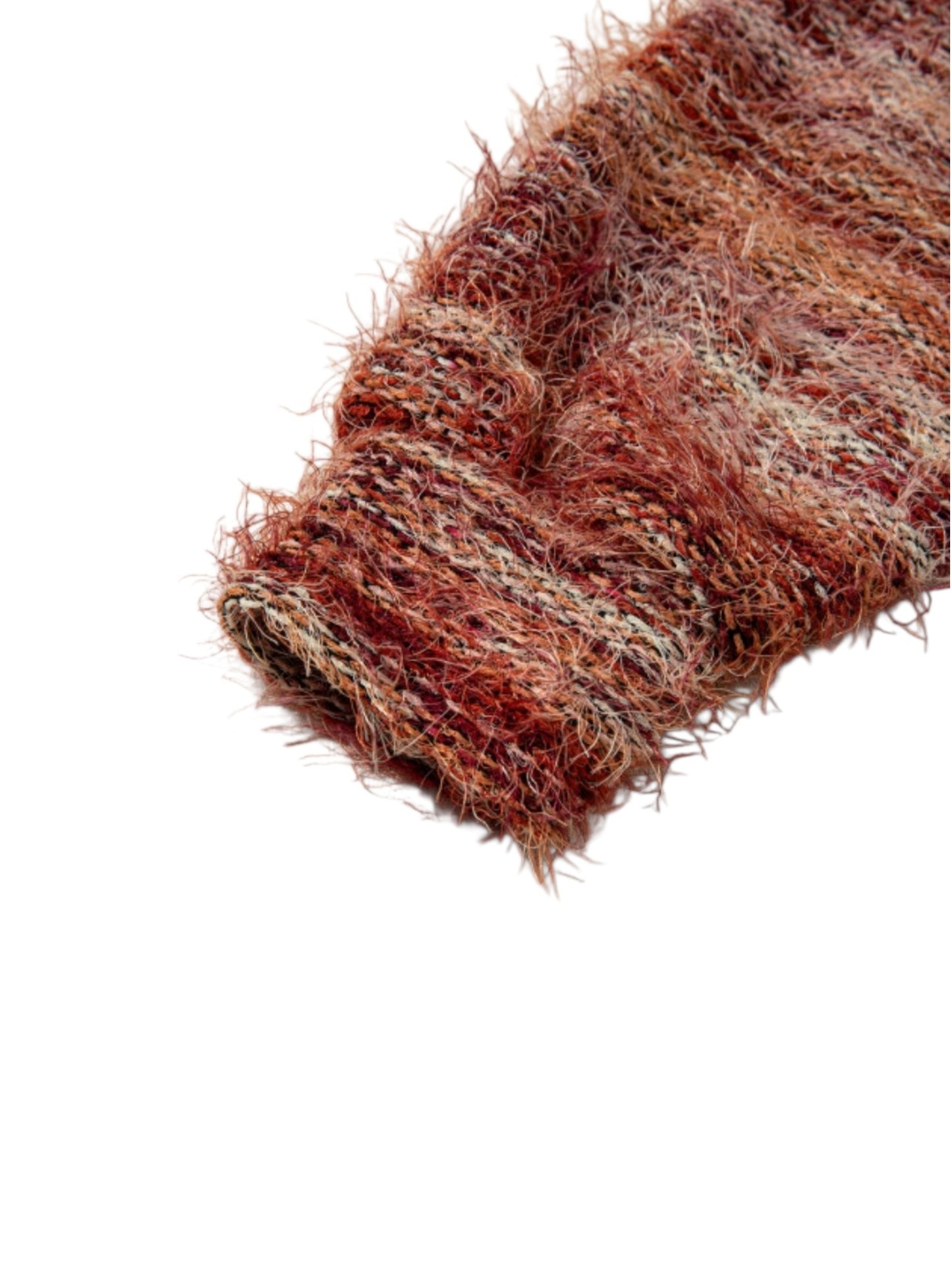A close-up of a chunky, fuzzy knit fabric in a variegated rust red, brown, and beige colorway, shown against a plain white background.