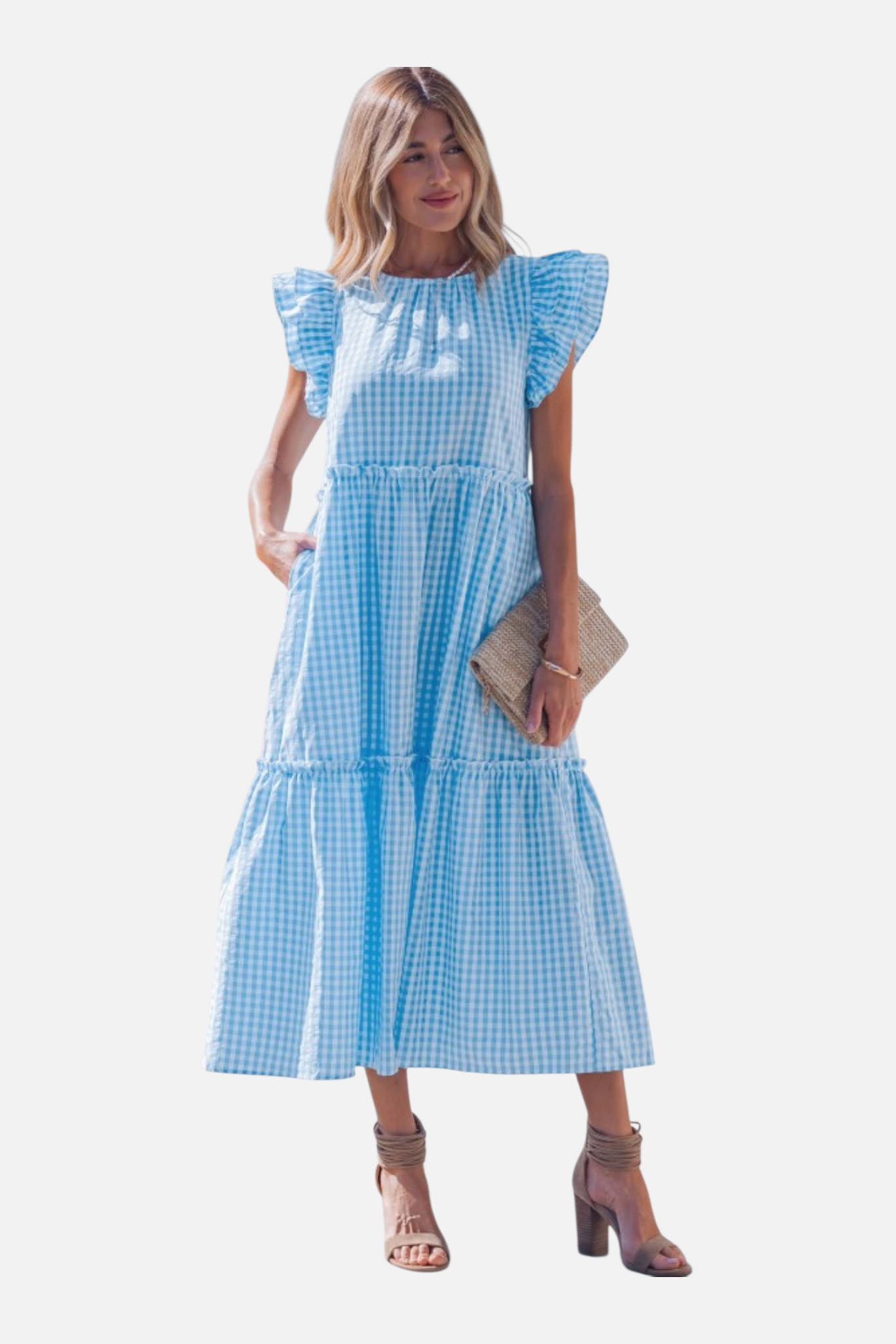 Woman wearing a blue checkered dress with ruffled sleeves on a white background
