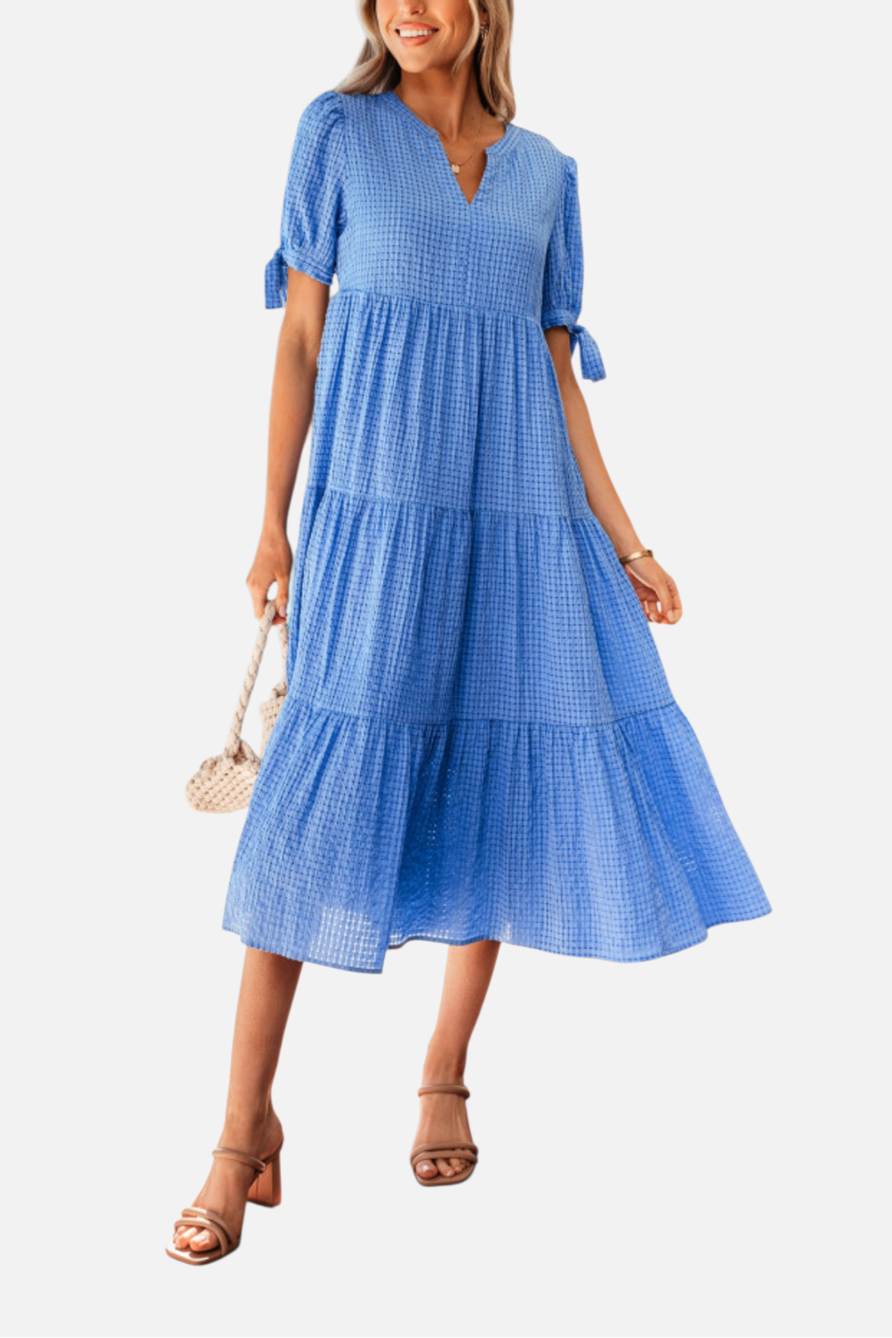 Woman wearing a blue dress on a white background