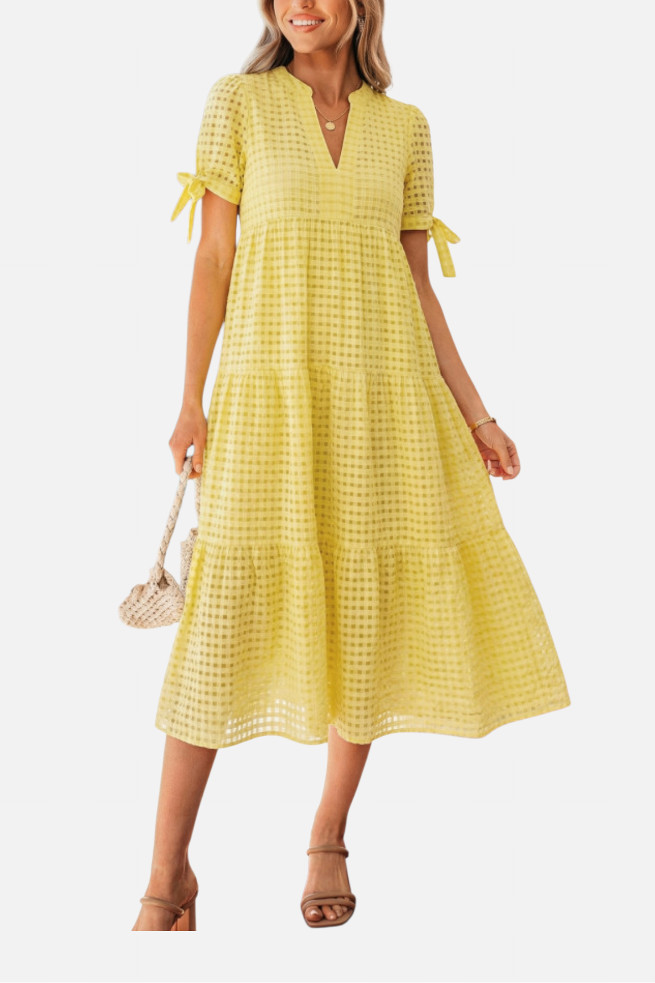 Woman wearing a yellow checkered dress on a white background
