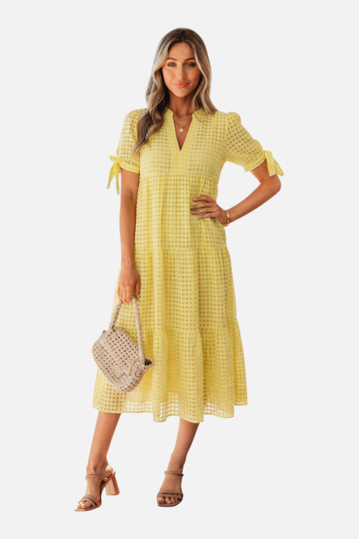 Woman wearing a yellow checkered dress on a white background