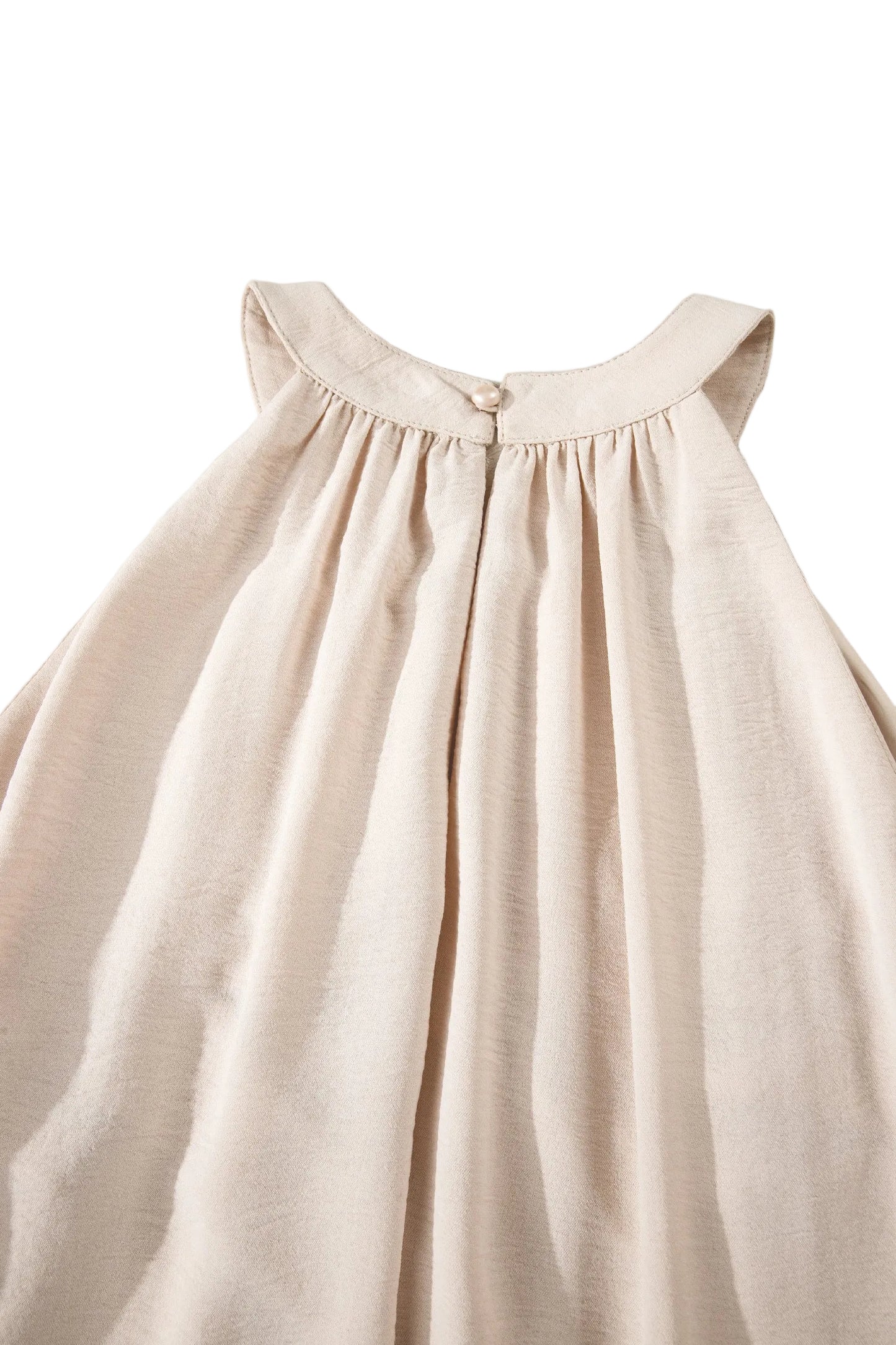 Beige dress on a light gray background