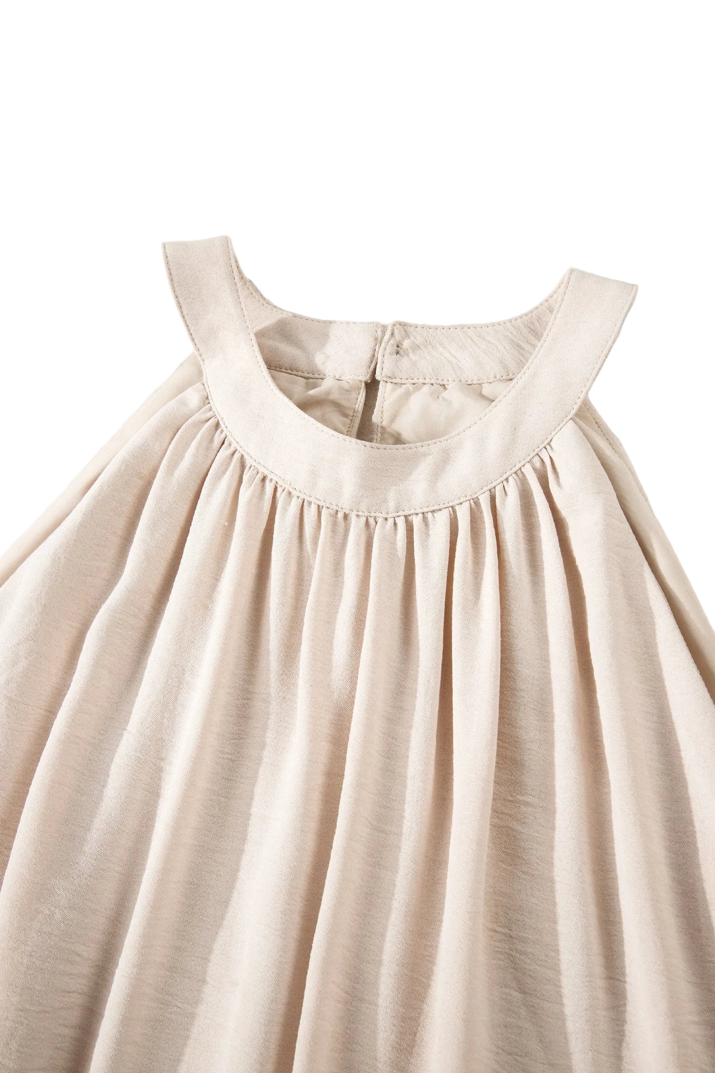 Beige dress with thin straps on a white background
