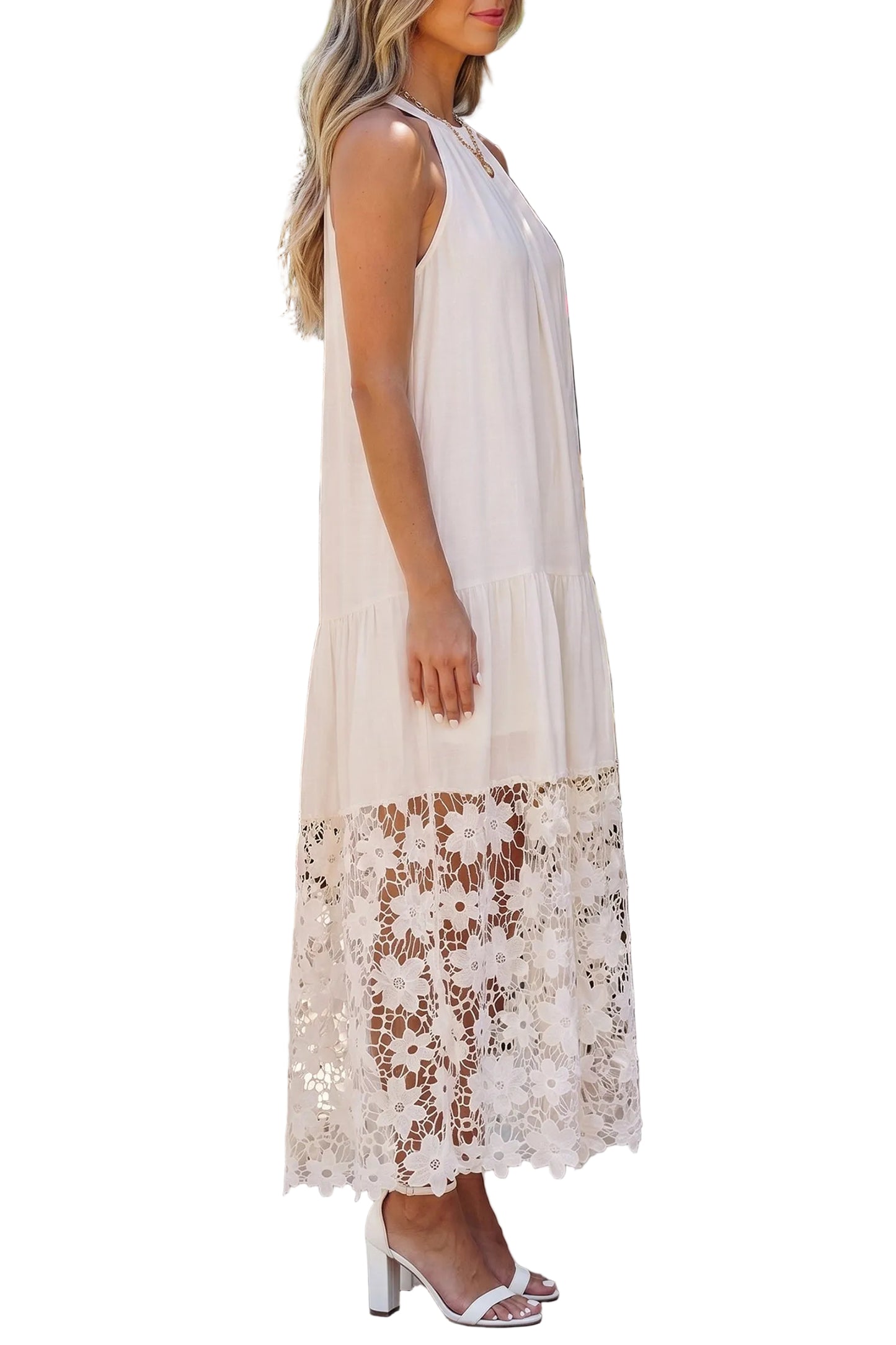 Woman wearing a white dress with lace details on a white background