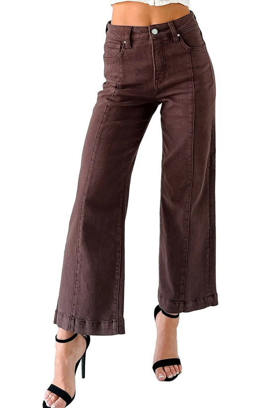 Brown wide-leg pants worn by a person on a white background