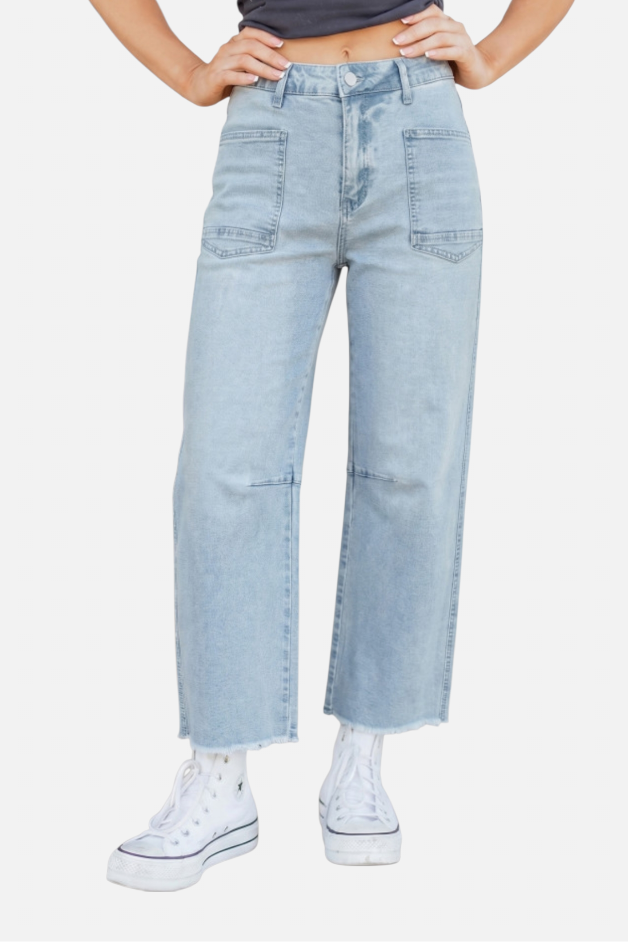 Light blue jeans worn by a person on a white background