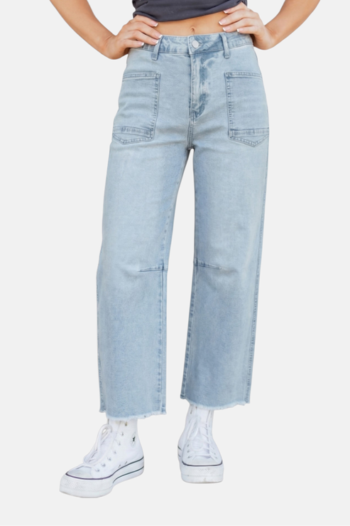 Light blue jeans worn by a person on a white background