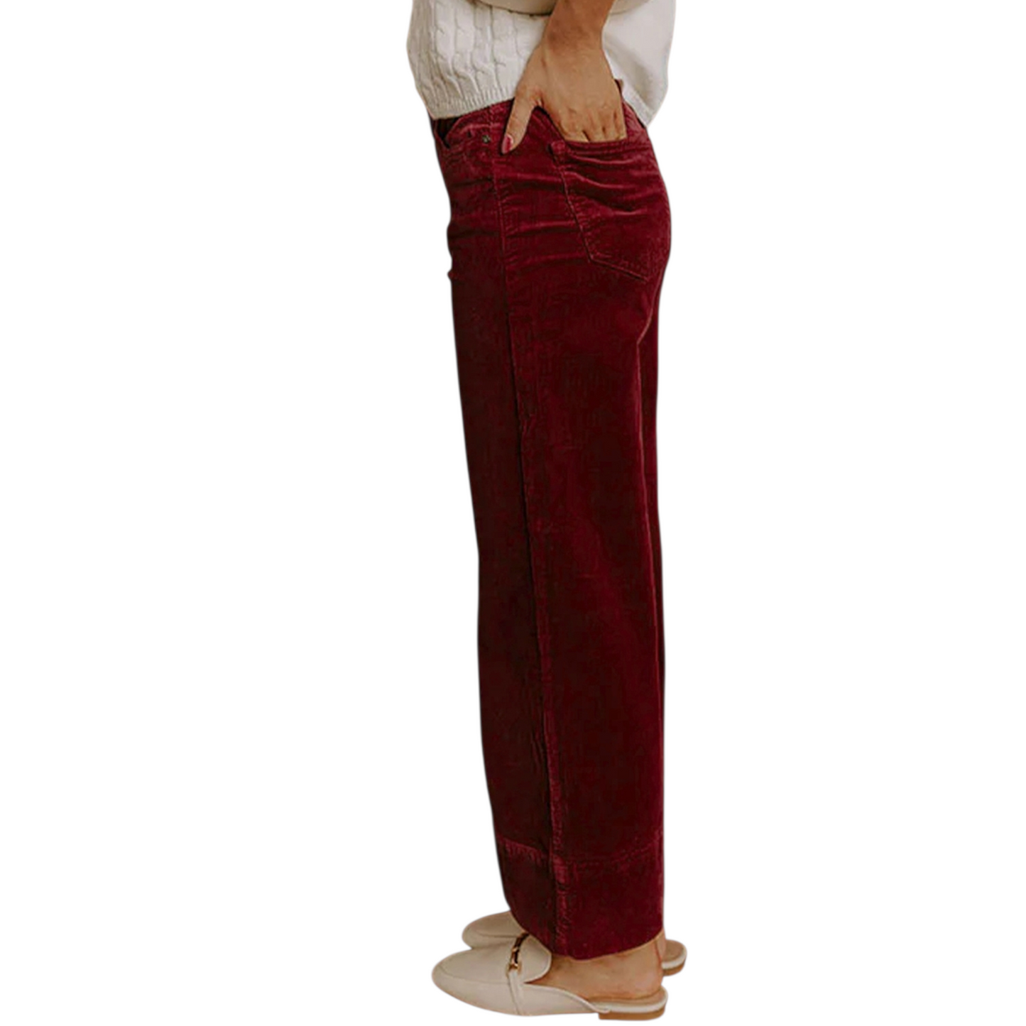 Person wearing burgundy high-rise wide-leg corduroy trousers with a white knit sweater and cream loafers.