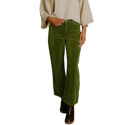 Person wearing olive green wide-leg corduroy pants with a high waist and dark brown ankle boots.