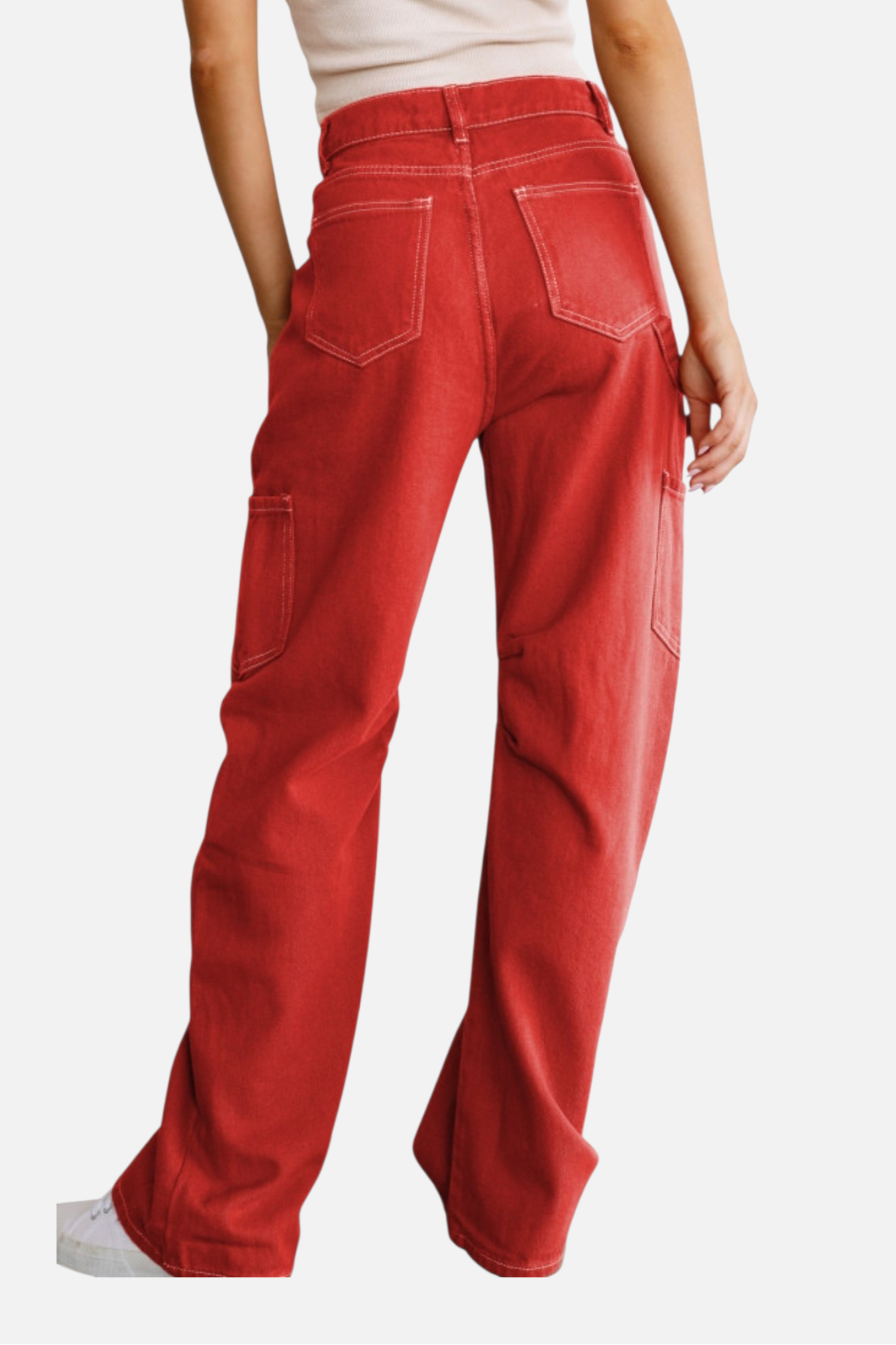 Red pants worn by a person on a white background