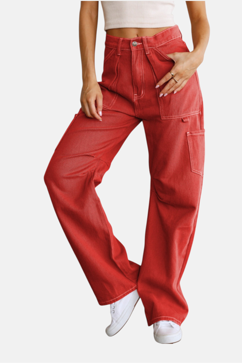 Red pants worn by a person on a white background
