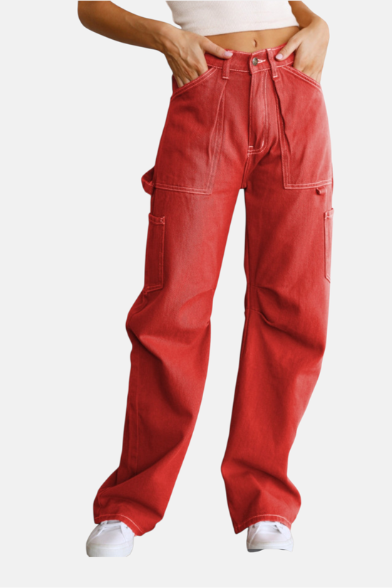 Red pants worn by a person on a white background