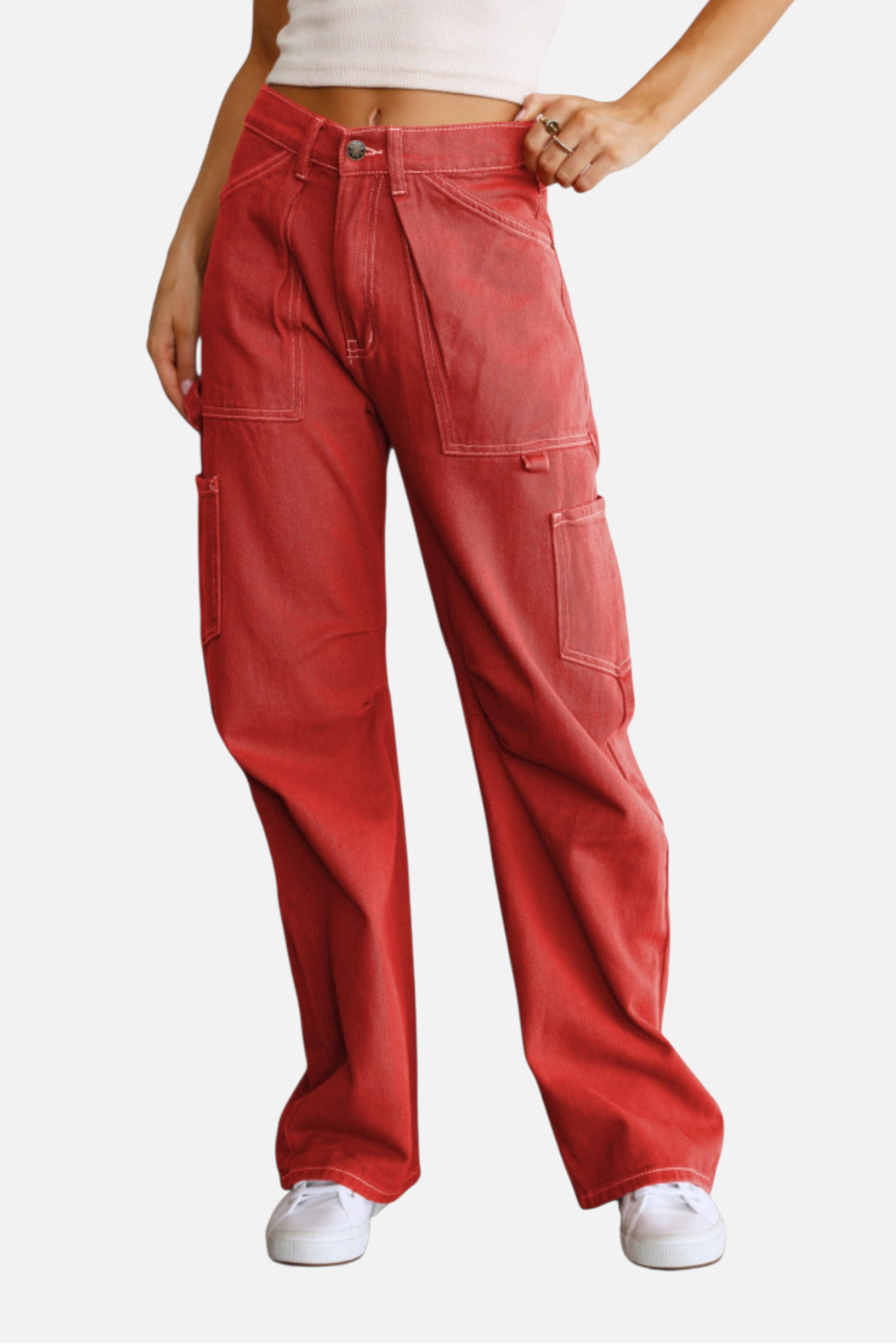 Red pants worn by a person on a white background