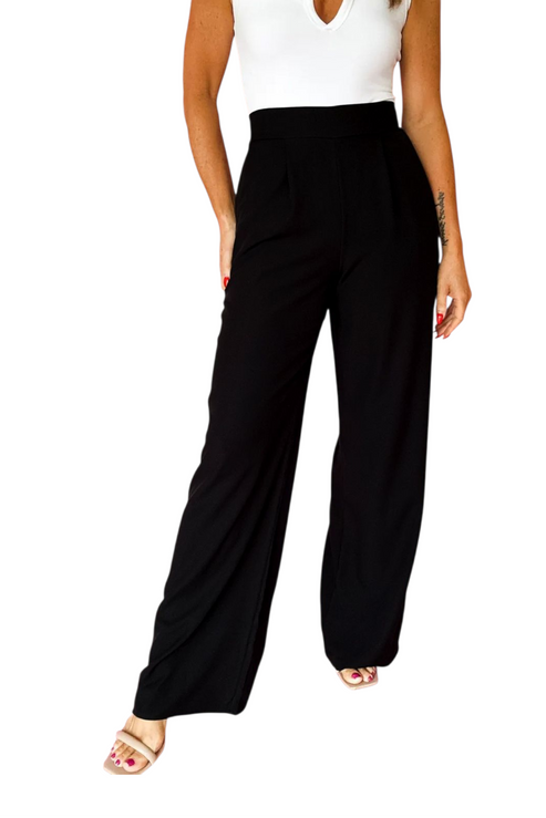 Black wide-leg pants worn by a person on a white background