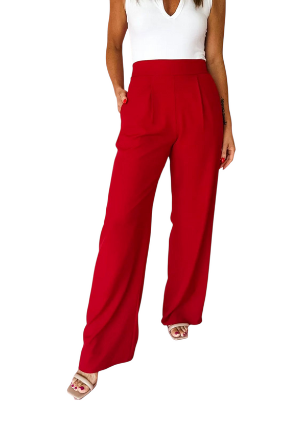 Red wide-leg pants worn by a person on a white background