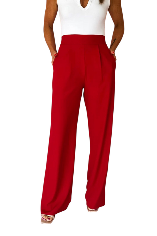 Red wide-leg pants worn by a person on a white background