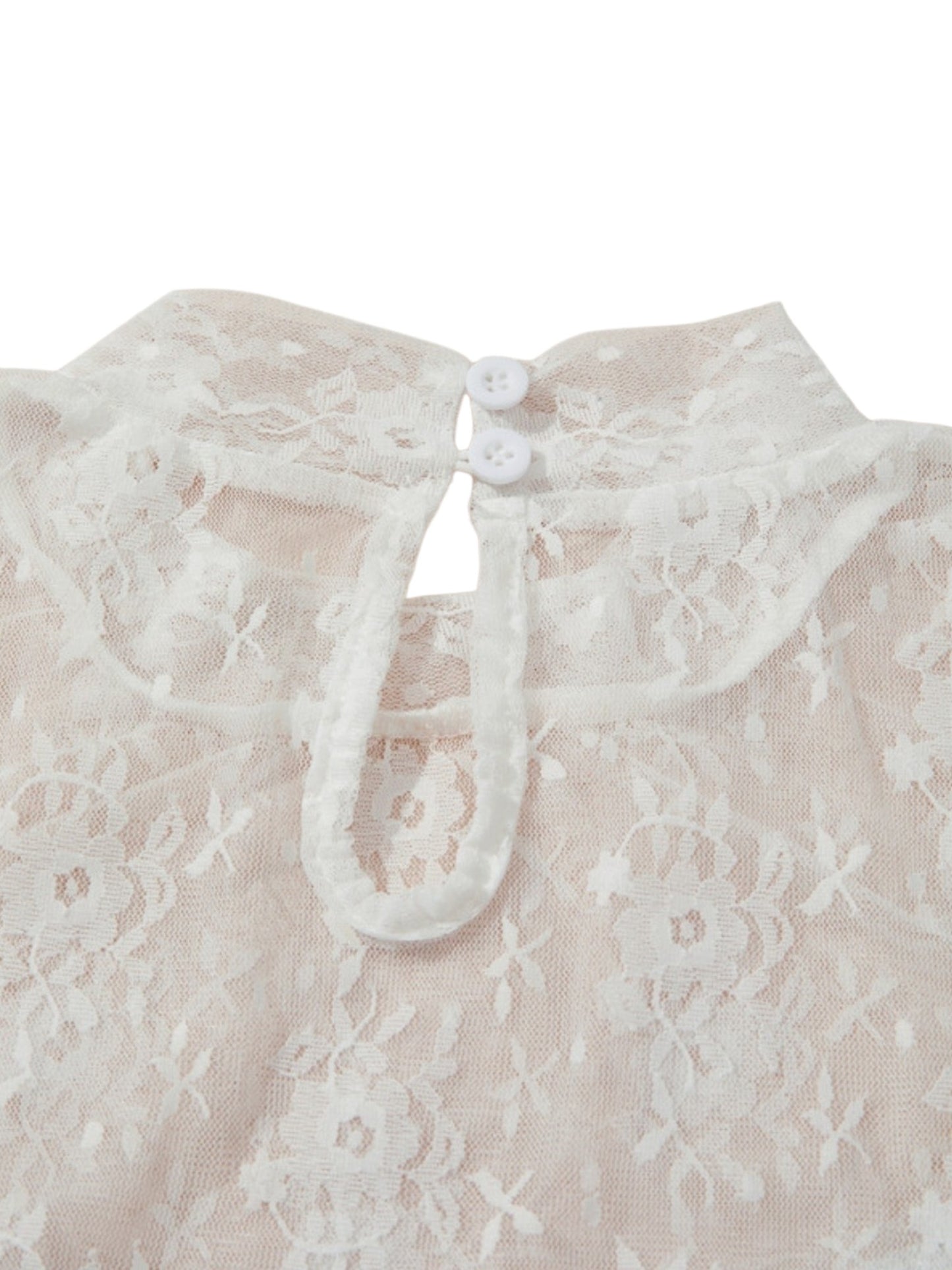 Close-up of a cream-colored lace blouse featuring a wide collar with two decorative buttons and a tie-front keyhole closure.