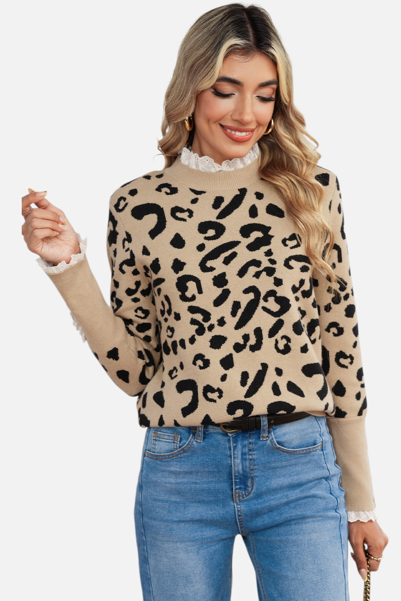 Model wearing the leopard print knit sweater paired with blue jeans, showcasing the elongated ribbed cuffs with decorative tonal buttons.