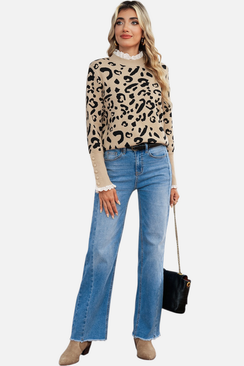 Full-body lifestyle shot of a model styling the lace-trim leopard sweater with wide-leg denim and tan boots for a chic autumnal look.