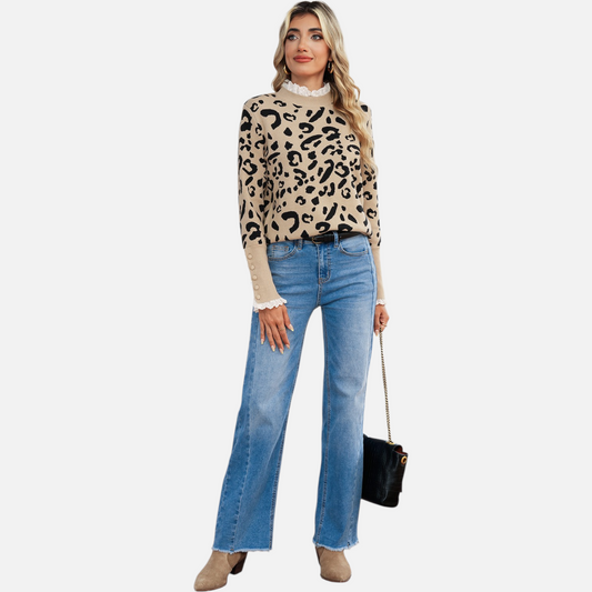 Full-body lifestyle shot of a model styling the lace-trim leopard sweater with wide-leg denim and tan boots for a chic autumnal look.