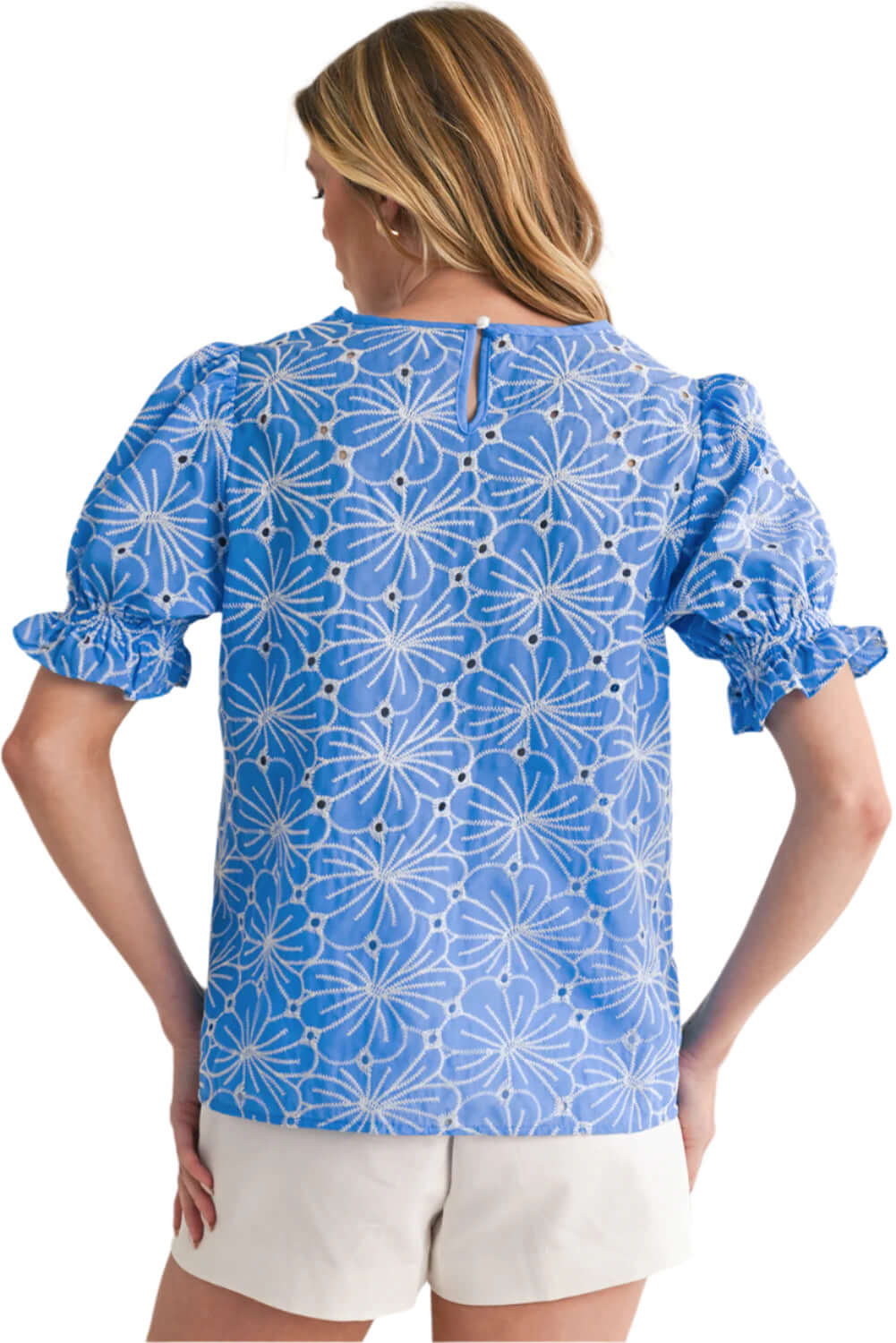 Back view of lightweight sky blue boho blouse with feminine puff sleeves.