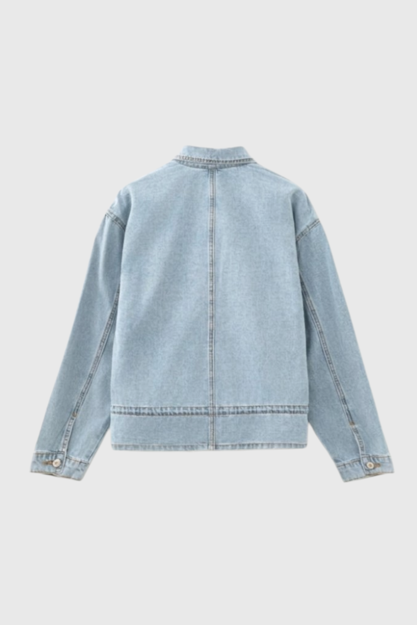 Professional back flat lay of a light blue denim jacket showcasing a clean back yoke, central seam detail, and adjustable drawstring waist.