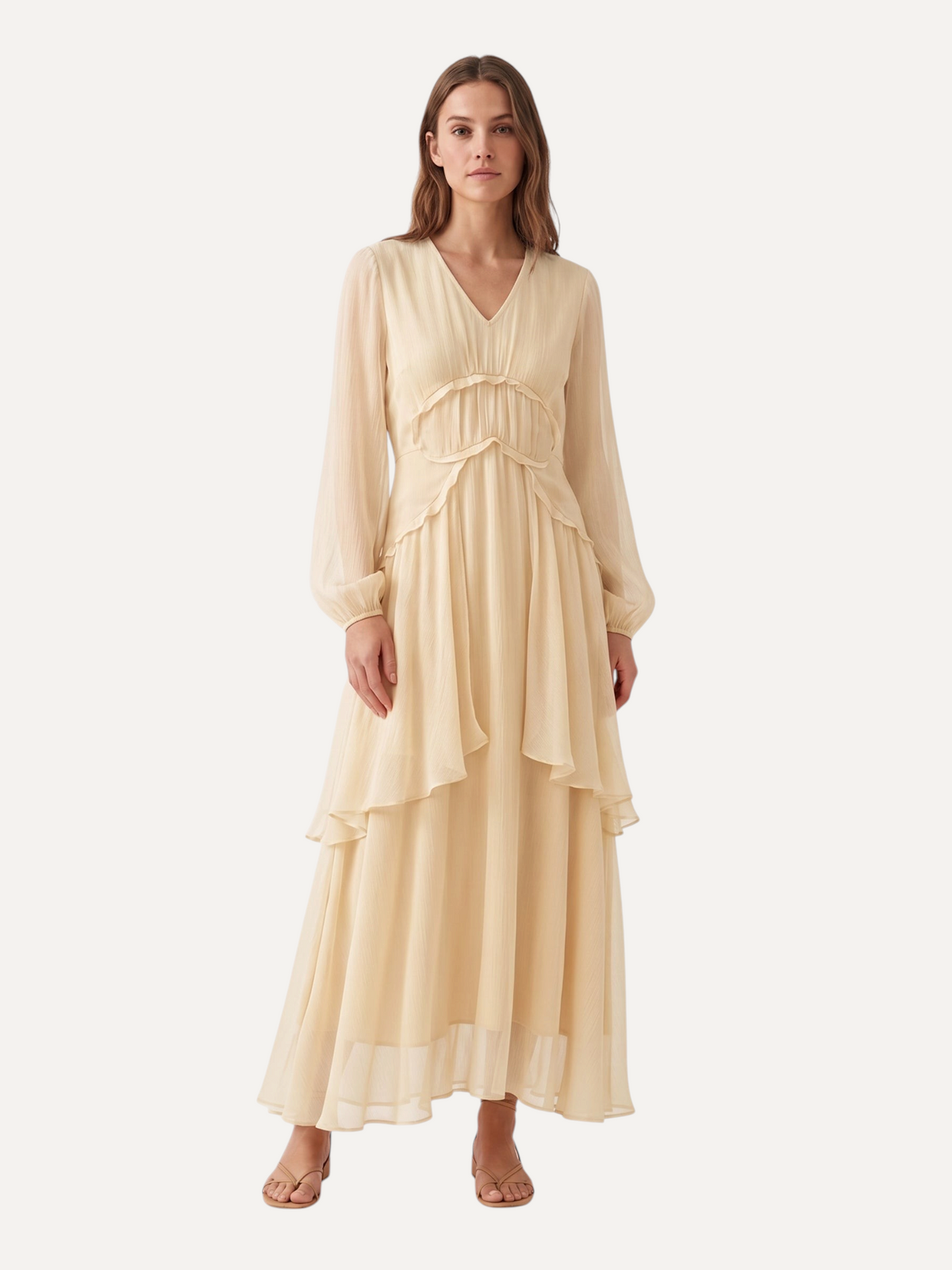 Catherine Martin light yellow mulberry silk maxi dress with V-neck, tiered skirt, and long sleeves on a model