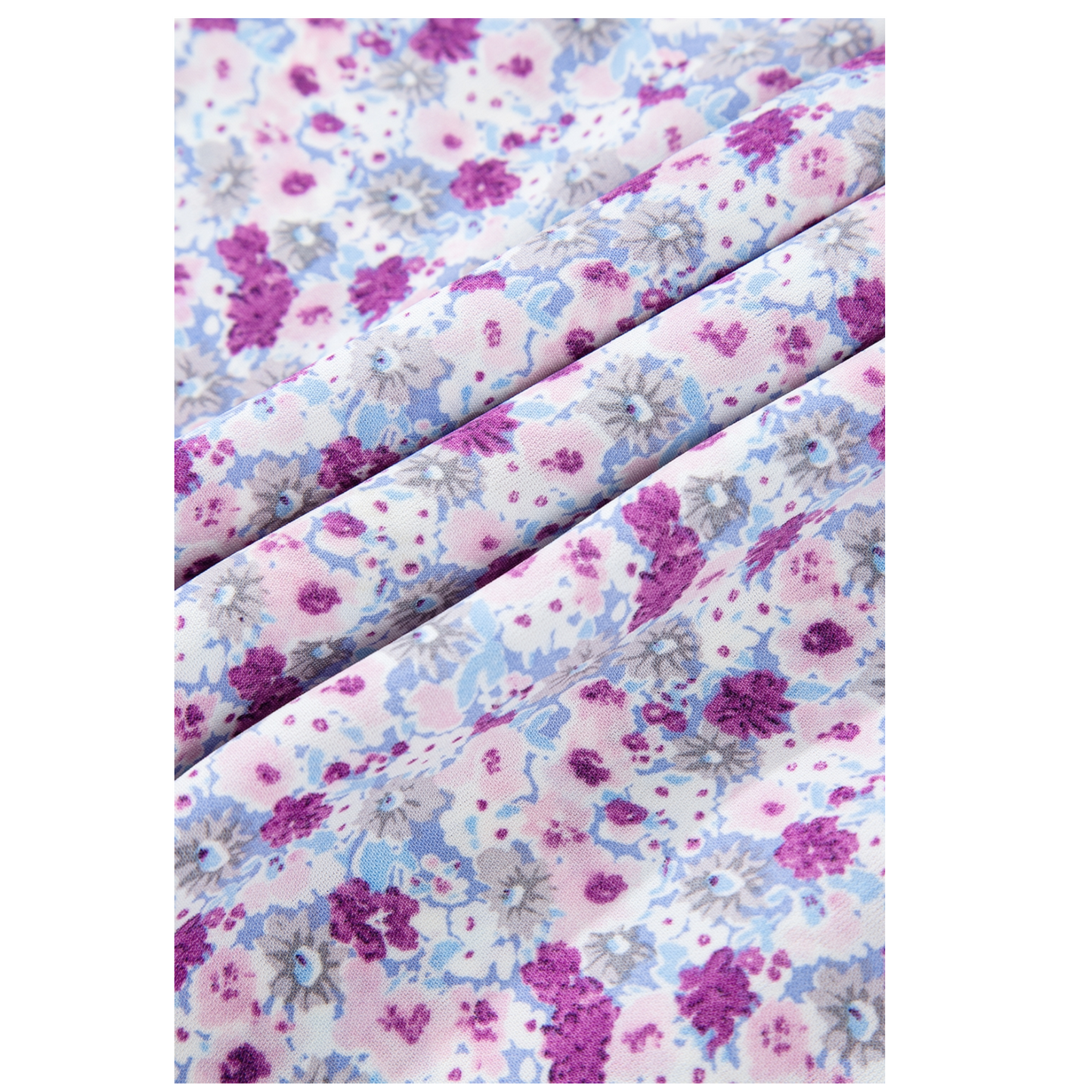 Floral patterned fabric with purple, pink, and blue colors on a white background