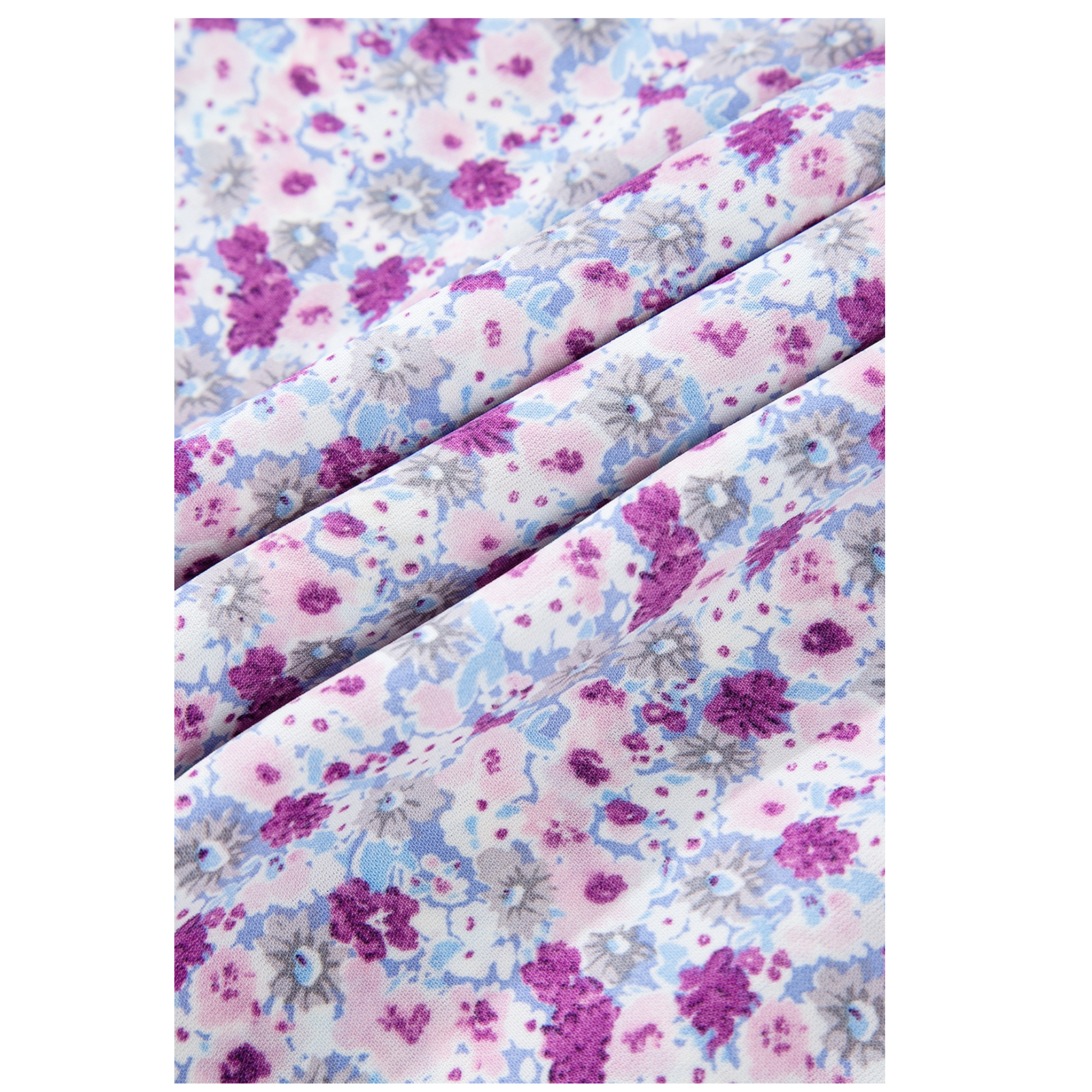 Floral patterned fabric with purple, pink, and blue colors on a white background