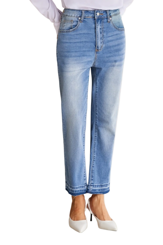 Light blue jeans worn by a person on a white background