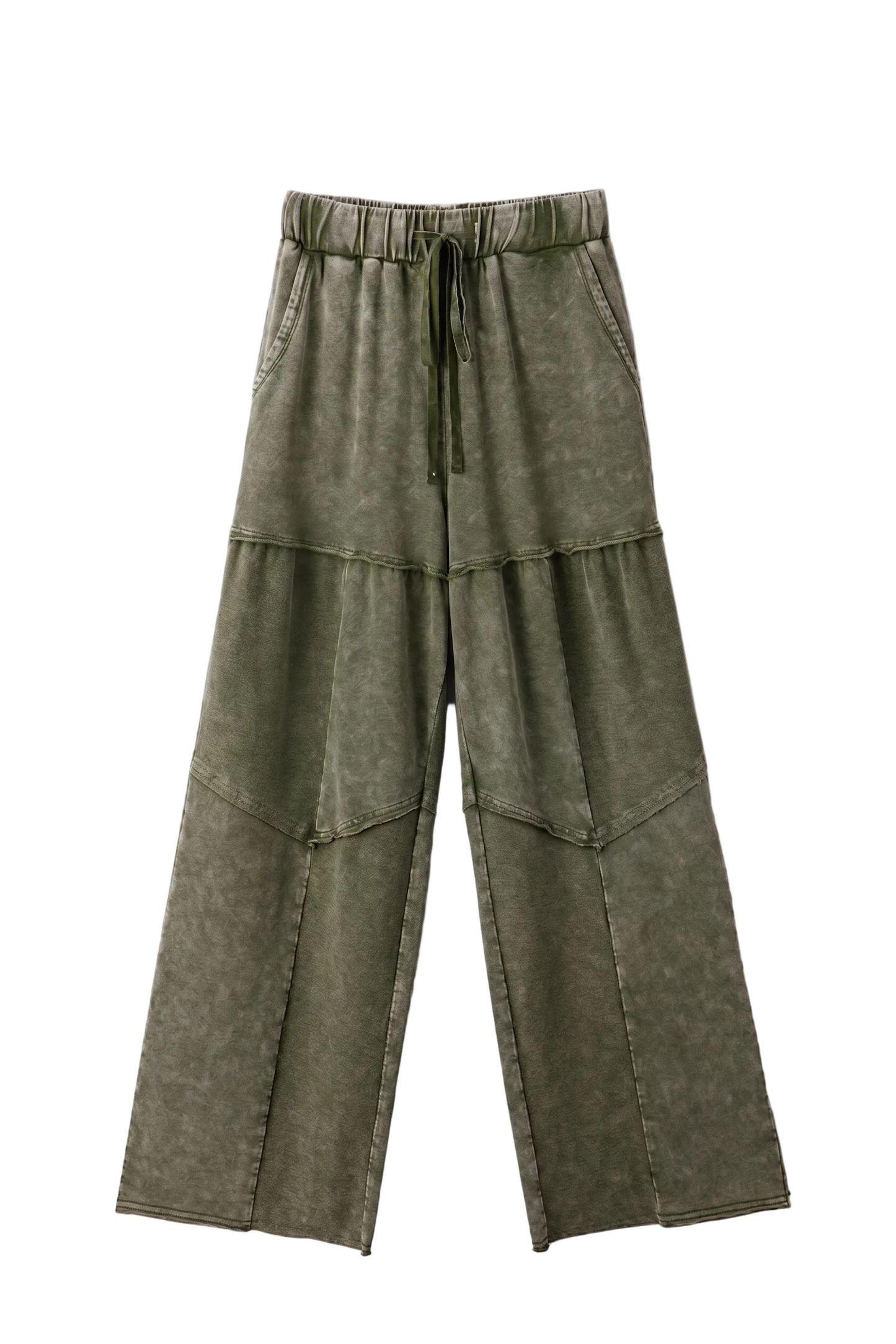 Green tiered pants on a white background