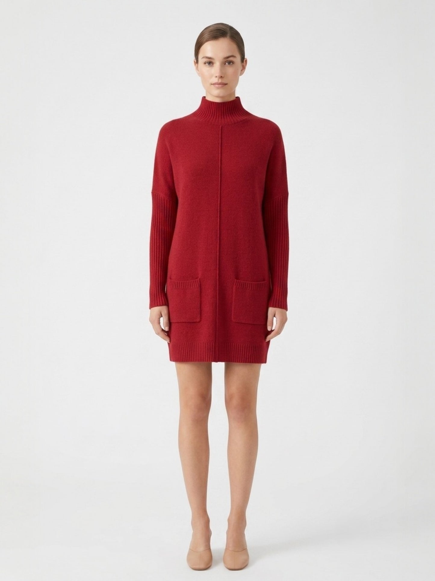 Red sweater dress worn by a model on a white background