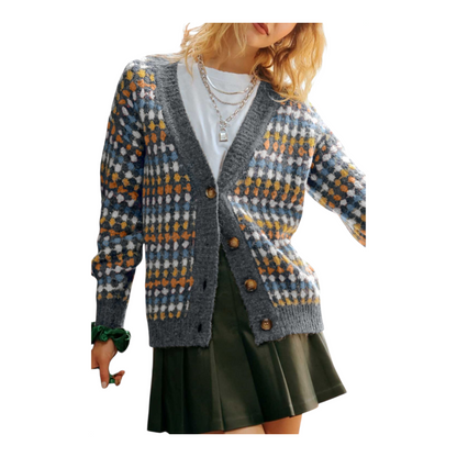 Person wearing a patterned cardigan on a white background