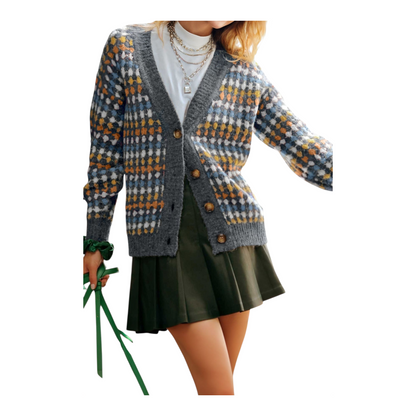 Person wearing a patterned cardigan and holding green ribbons on a white background