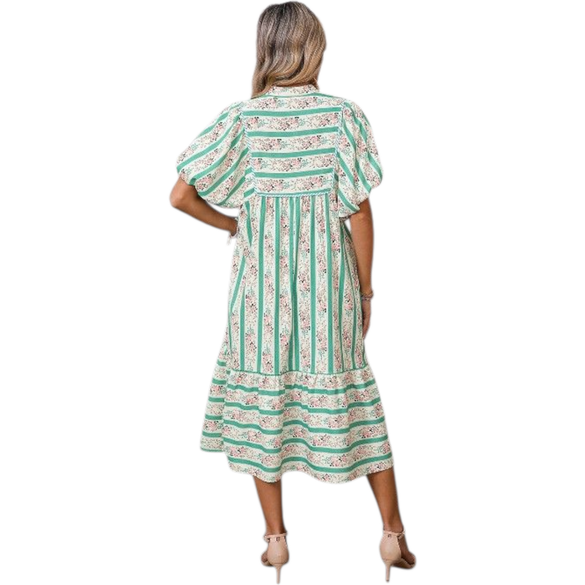 Woman wearing a green and white patterned dress on a white background