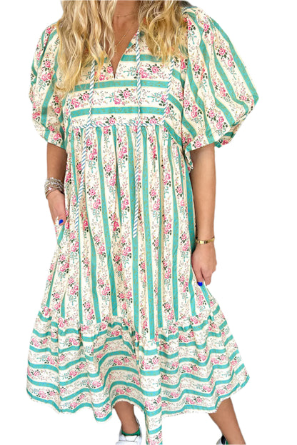 Front view of a multicolor boho floral striped long dress with a tie V-neckline and relaxed fit.