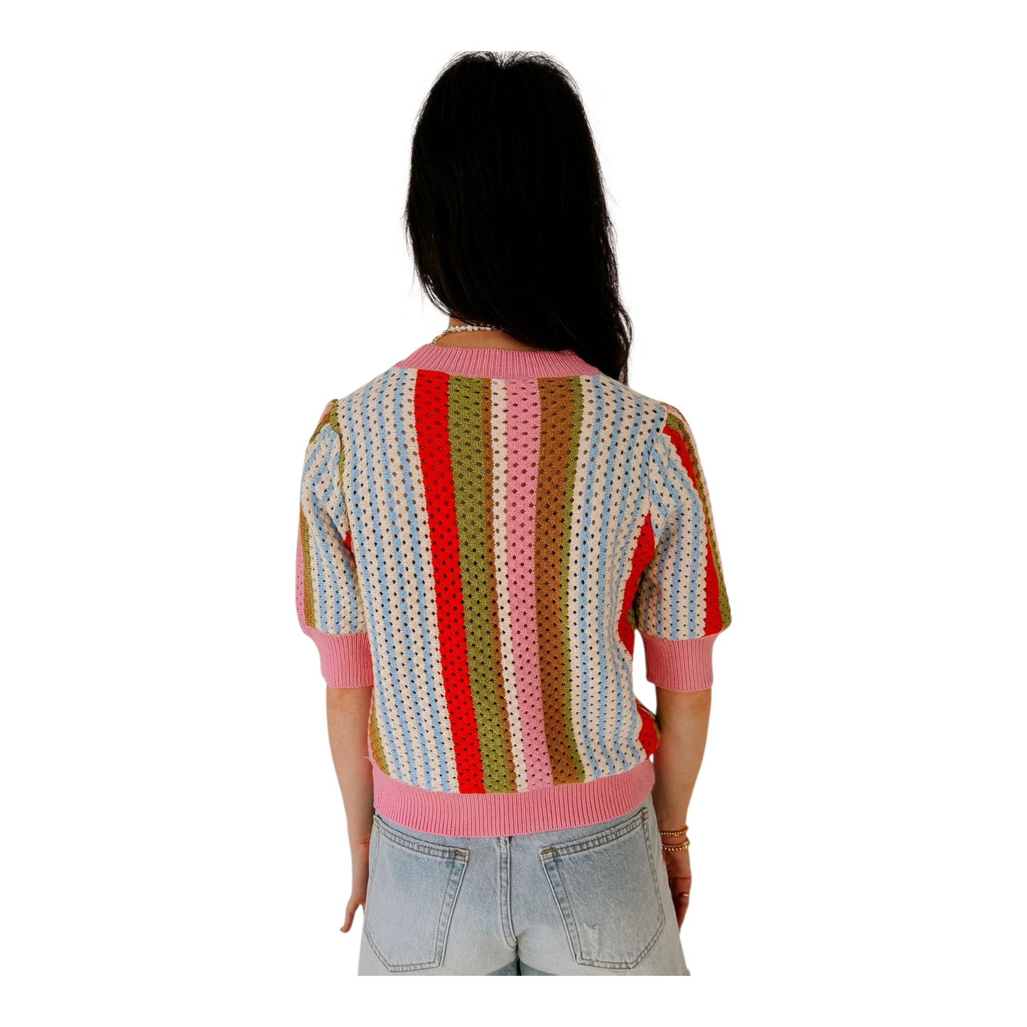 Person wearing a colorful striped sweater on a white background
