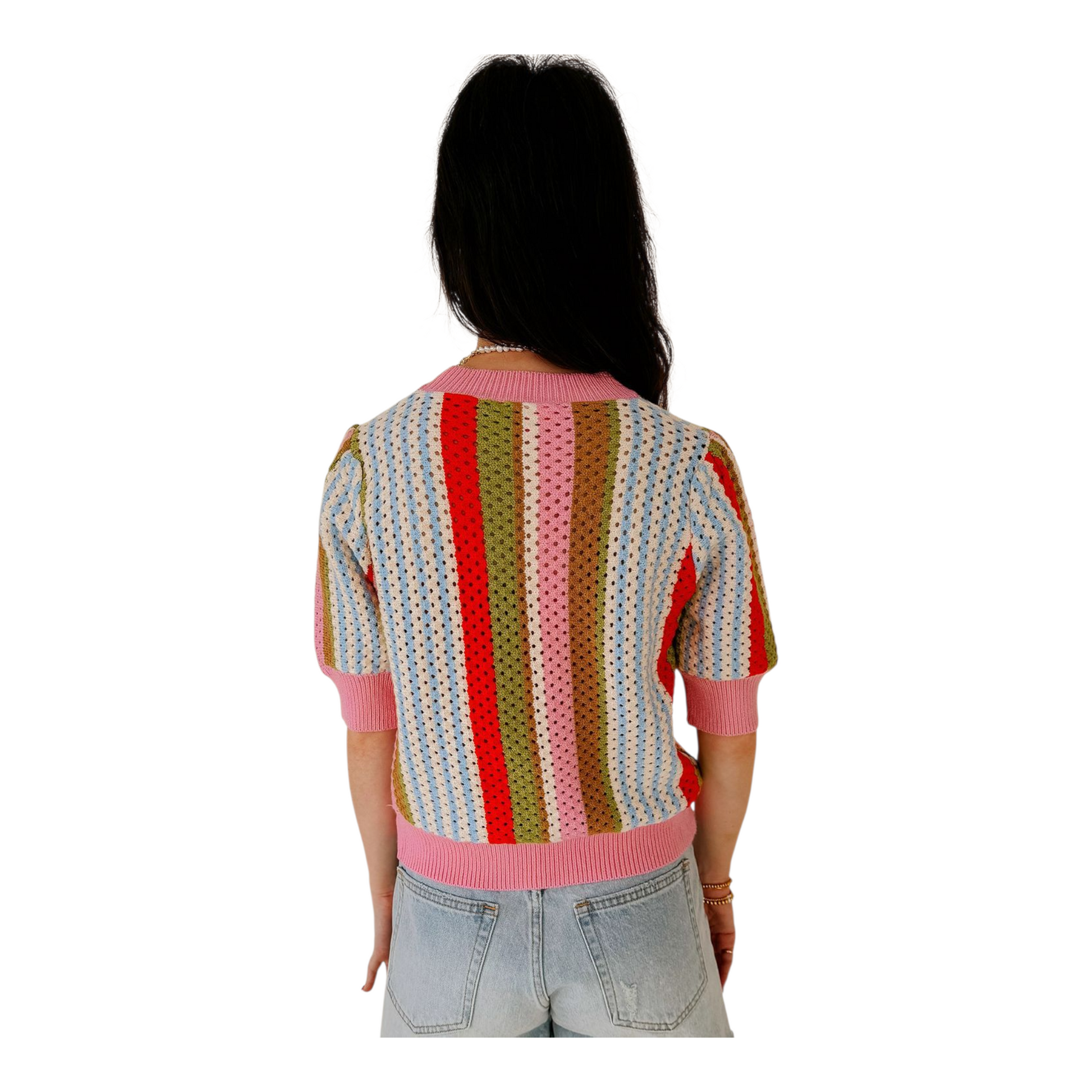 Person wearing a colorful striped sweater on a white background