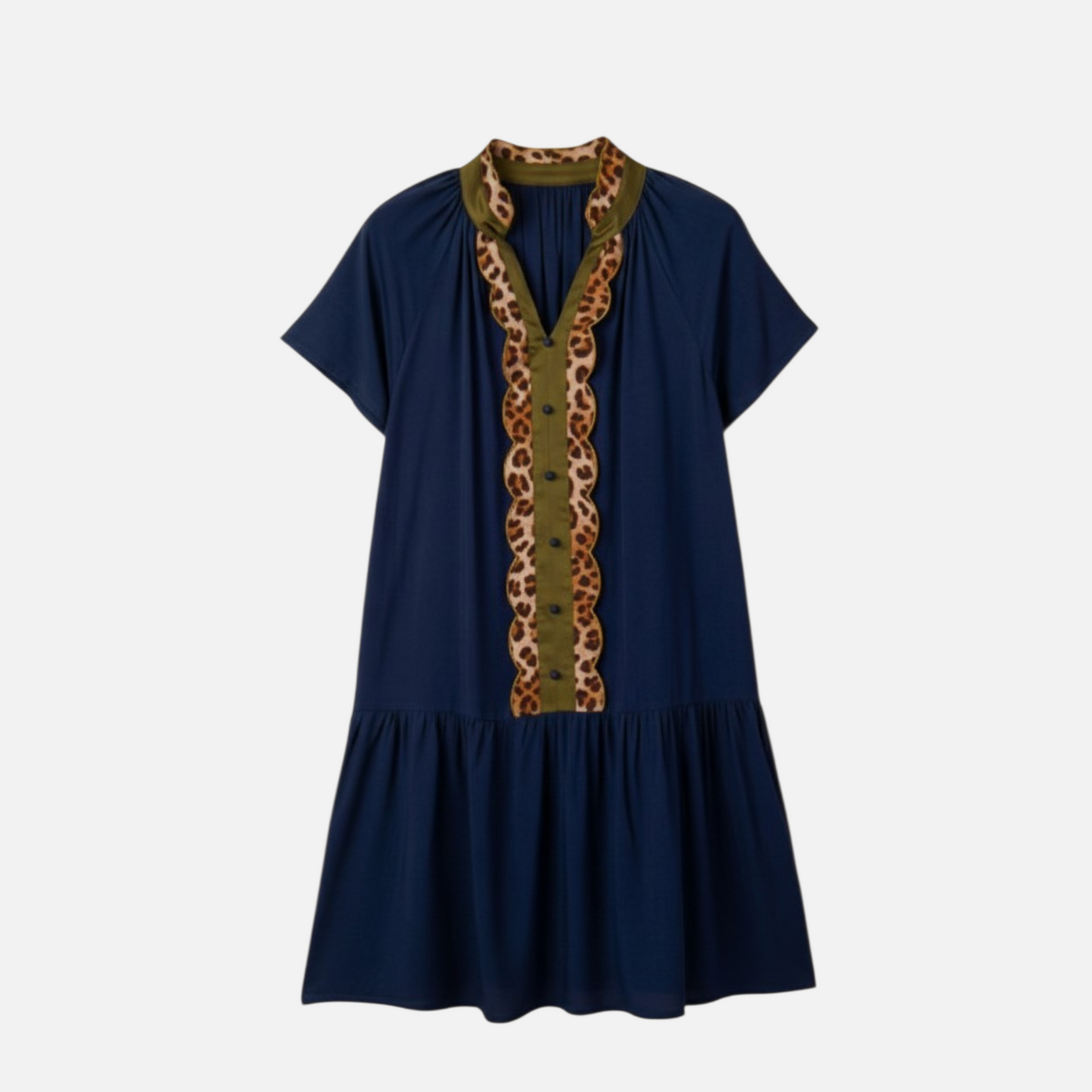 A front view of a navy blue drop-waist shift dress featuring a decorative leopard print trim, olive green contrast panelling, and a button-down V-neckline.