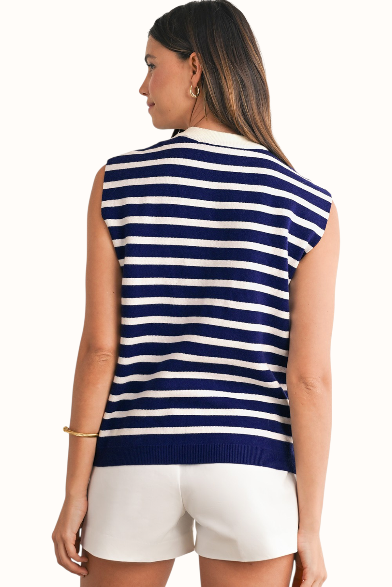 Rear view of a navy and white horizontal striped knit vest featuring three delicate white decorative bows and a classic crew neckline.