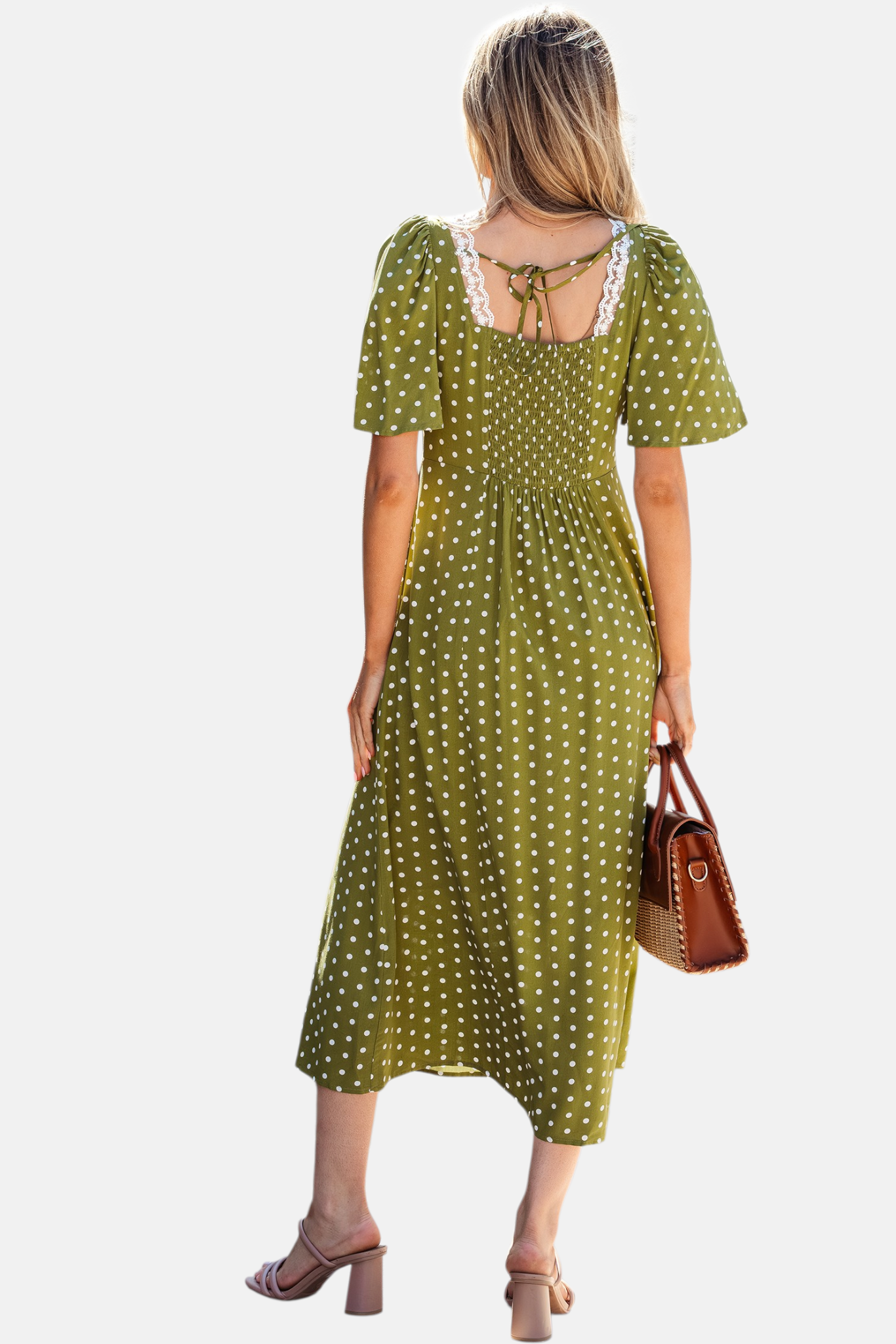 Olive polka dot lace trim smocked midi dress back view showing smocked bodice and tie detail styled with tan heels and brown handbag