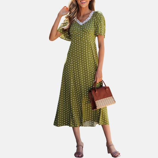 Olive polka dot lace trim smocked midi dress front view styled with tan block heels and rattan leather handbag