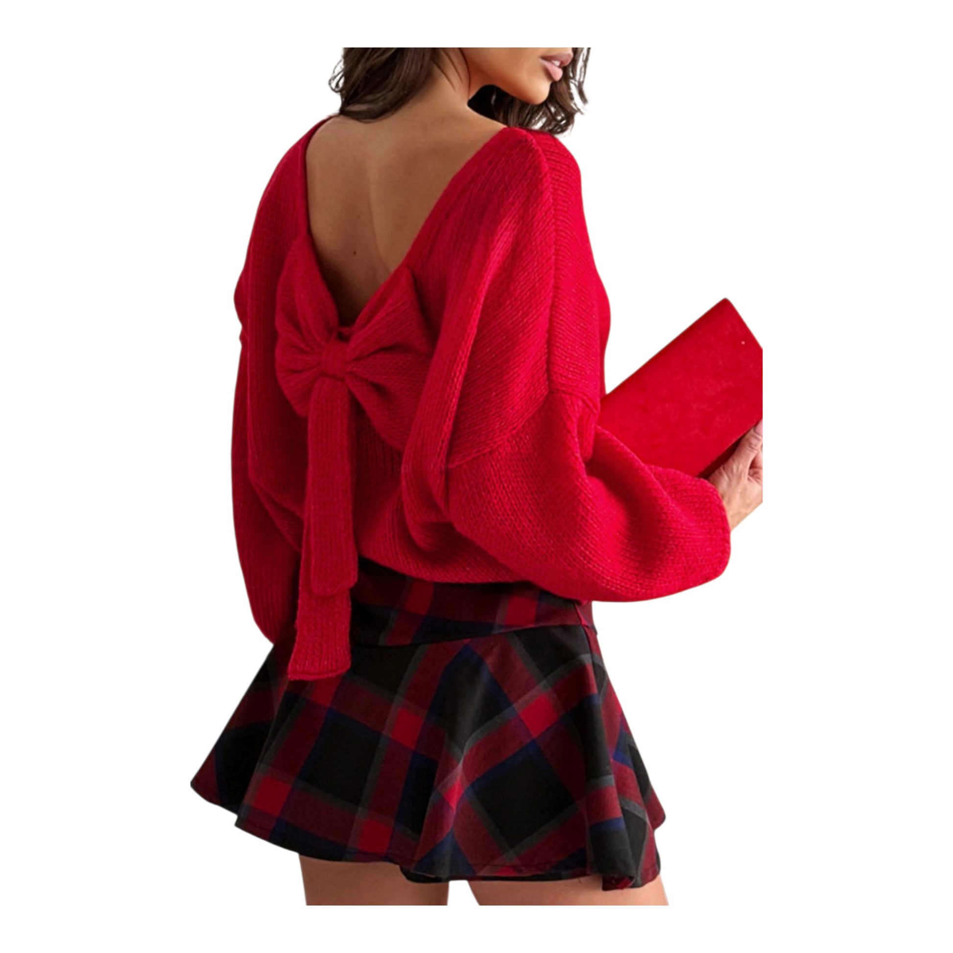 Red sweater with a bow detail and plaid skirt on a white background