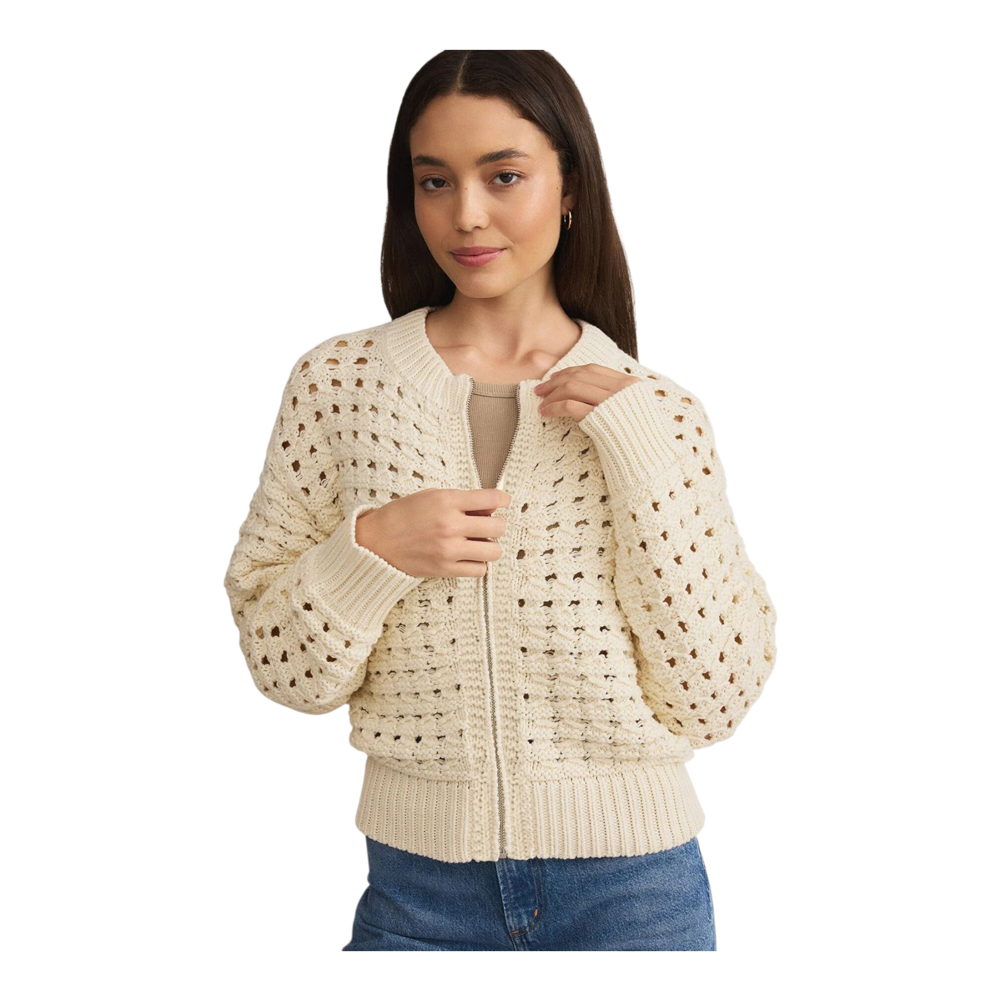 Woman wearing a beige zip-up sweater on a white background