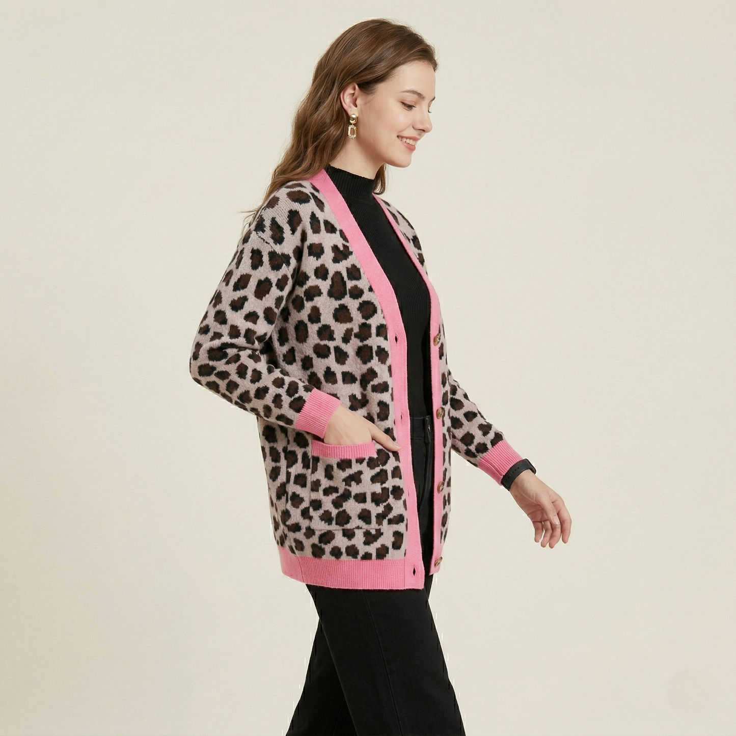 Side profile view of the oversized leopard cardigan demonstrating the comfortable drop-shoulder design and mid-thigh length.