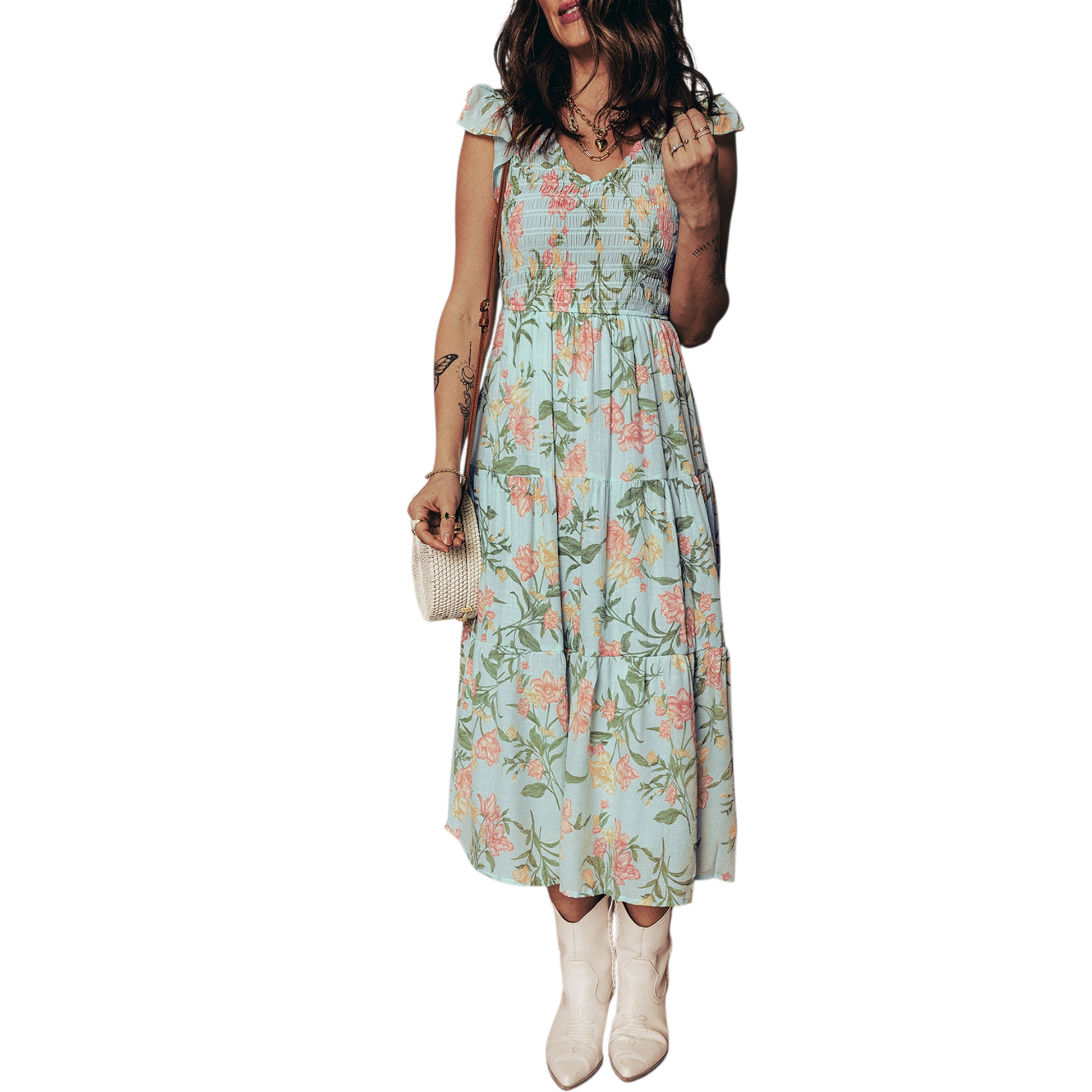 A tiered mint green maxi dress with a pastel floral print, featuring a smocked bodice and ruffled cap sleeves.